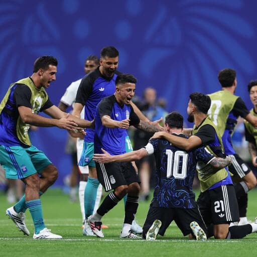 Argentina national football team players celebrate a decisive goal during an international match, highlighting teamwork, emotion, and victory on the field.